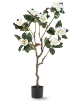 La planta Yulania Artificial 120 cm con flor es un árbol de magnolia artificial en maceta con múltiples ramas, grandes hojas de color verde brillante y varias flores blancas sobre un fondo liso blanco.