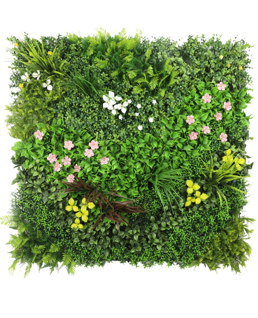 El seto artificial Vitality 100x100 cm UV es un panel cuadrado con un denso follaje artificial verde y ramos dispersos de pequeñas flores rosas, amarillas y blancas sobre un fondo blanco.