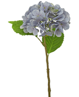 La Hortensia Artificial Deluxe 55 cm violeta tiene un único tallo violeta claro con pétalos redondeados y dos hojas verdes, sobre un fondo blanco.