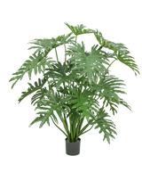 Planta artificial filodendro de 125 cm con hojas grandes, verdes y profundamente divididas sobre un fondo blanco.