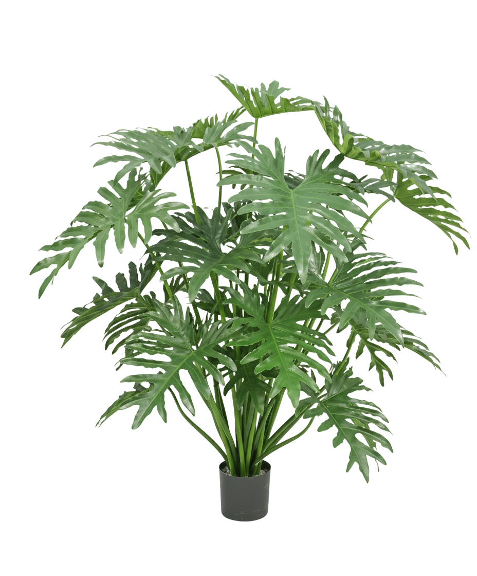 Planta artificial filodendro de 125 cm con hojas grandes, verdes y profundamente divididas sobre un fondo blanco.