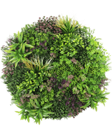 Una vista superior del seto artificial con marco negro de Ø100 cm muestra una exhibición densa y exuberante de plantas de hojas verdes y violetas dispuestas en un patrón circular sobre un fondo blanco.