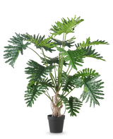 De Kunstplant Philodendron 180 cm heeft grote, glanzende, diep gelobde groene bladeren en is afgebeeld tegen een effen witte achtergrond.