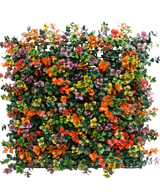 De Kunsthaag Pachysandra multi-color 50x50 cm UV is een vierkant kunstgroen bladerpaneel met dichte trossen kleine oranje, gele, roze en paarse bloemen tegen een witte achtergrond.